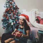 christmas photoshoot Model in front of tree