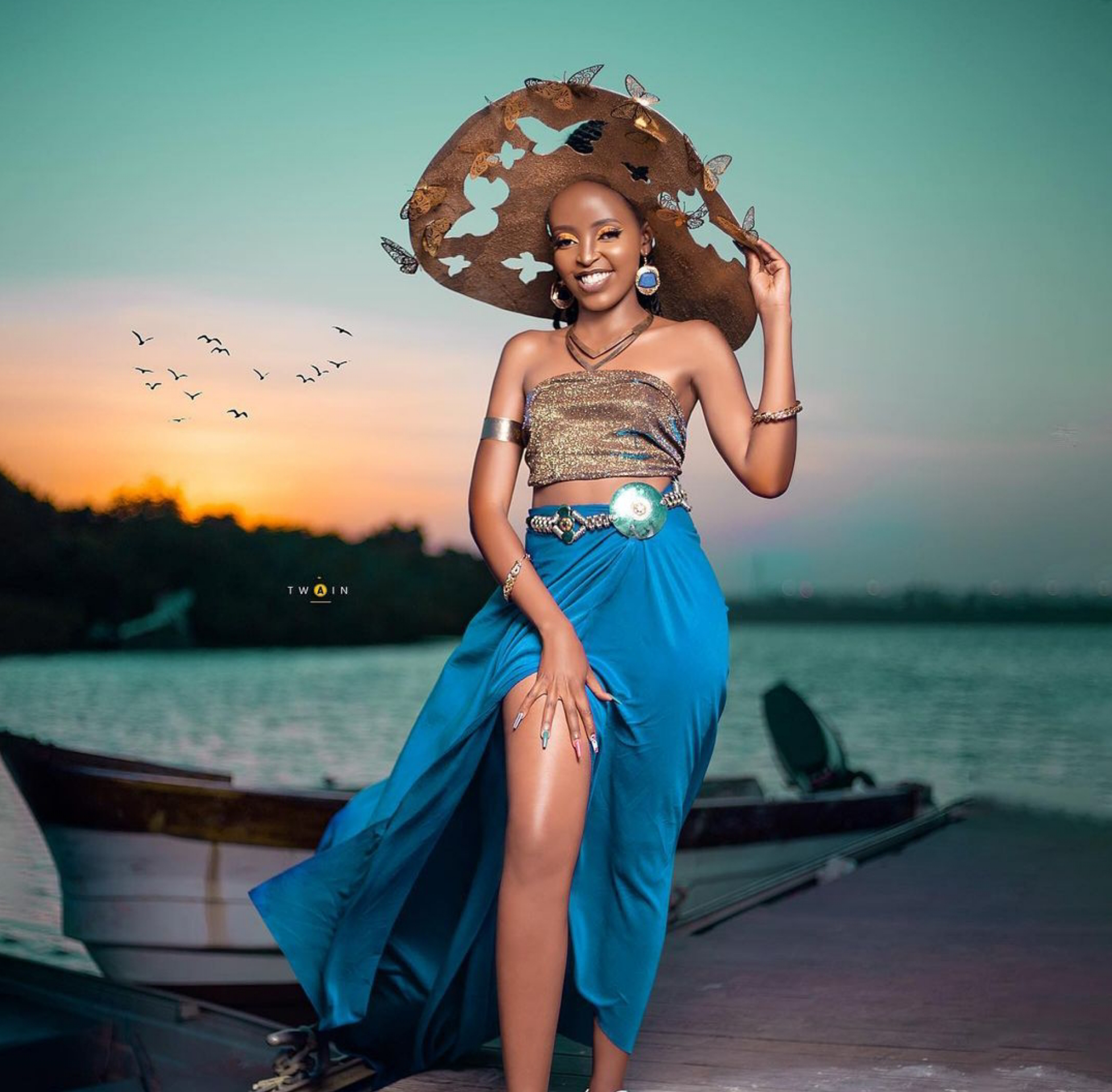 Mungai Eve in Sky Blue dress and some African headgear