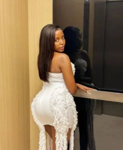 in a white mini dress