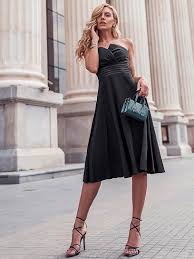 in a classic black dress