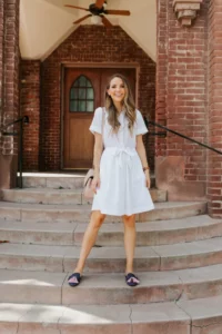 in a shirtless dress with a pair of flat shoes