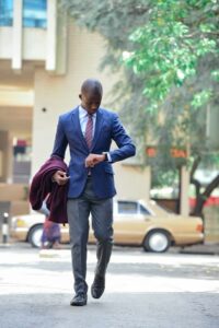 in a navy blue blazzer