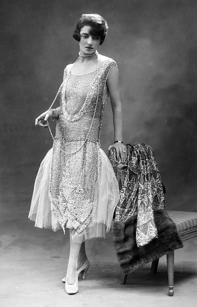 Woam wearing 1920s dress fashion evolution