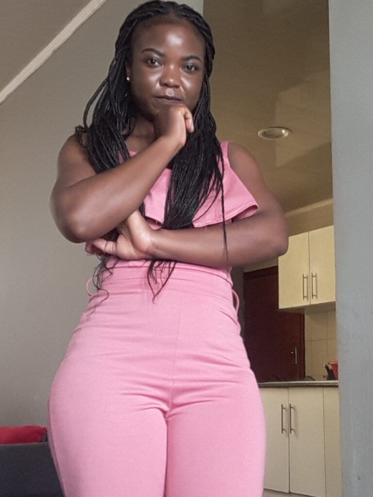 Embracing your curves curvy woman in pink outfit 