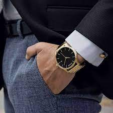Man wearing gold watch