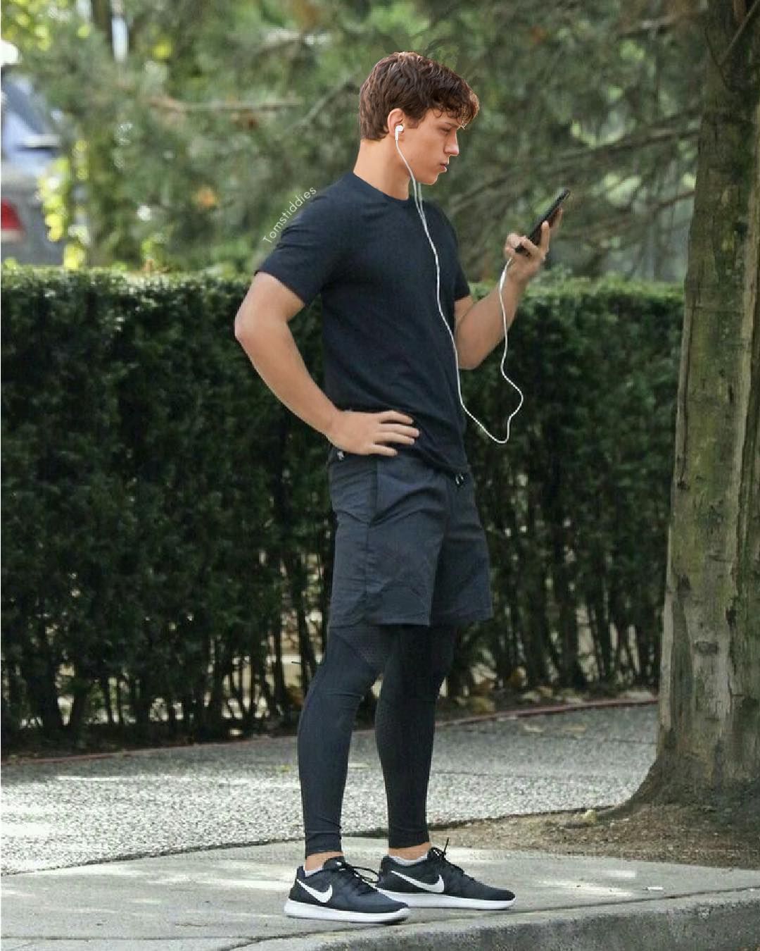 Tom Holland wearing ear buds