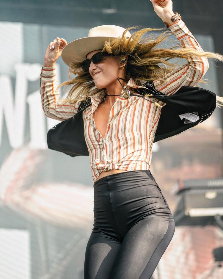 Concert Outfit Ideas Inspired by Lainey Wilson cowgirl with leather pants