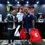 Collections by BK Proctor men in store with bags bearing BK logo