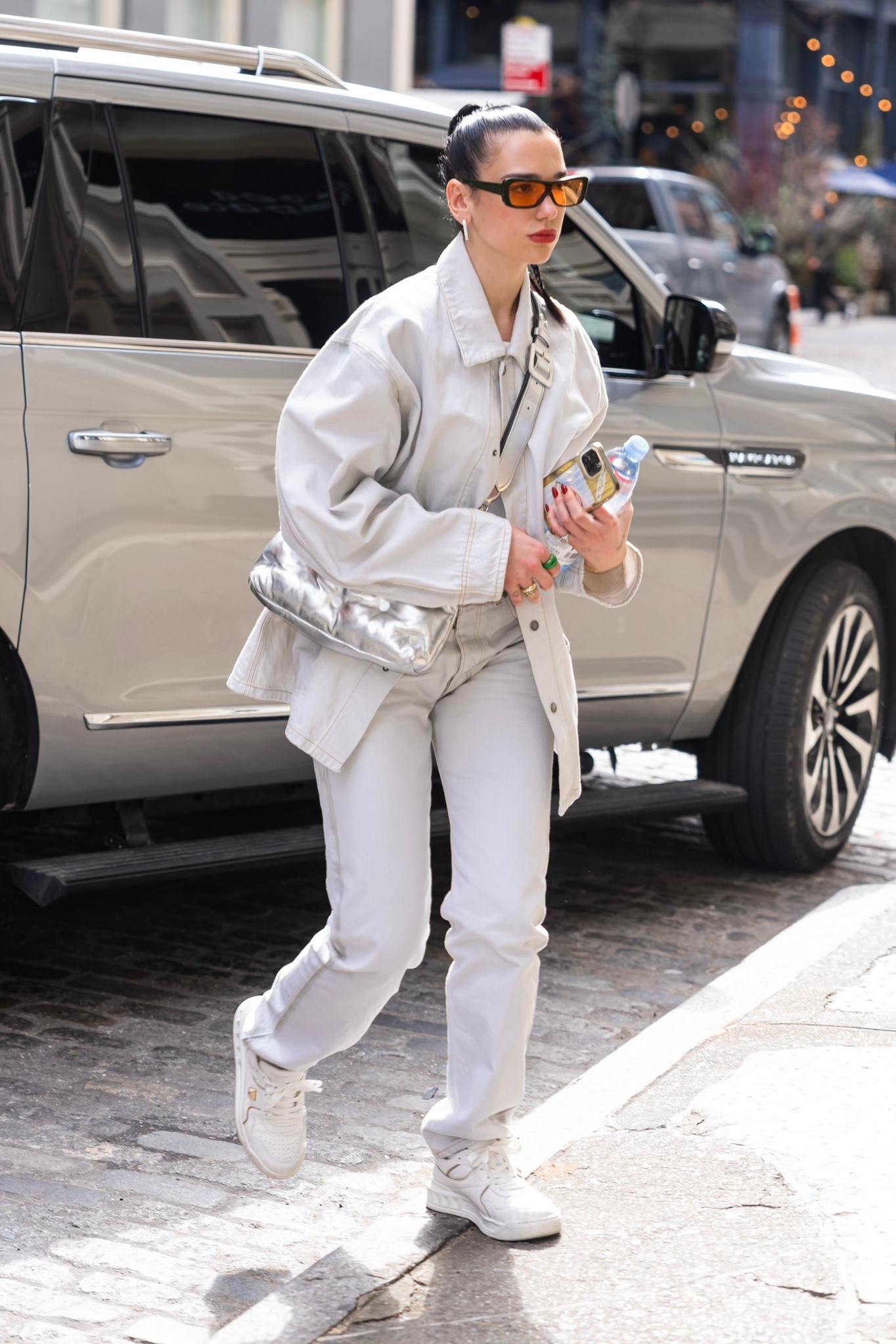 Dua Lipa street style white jeans and jacket 
