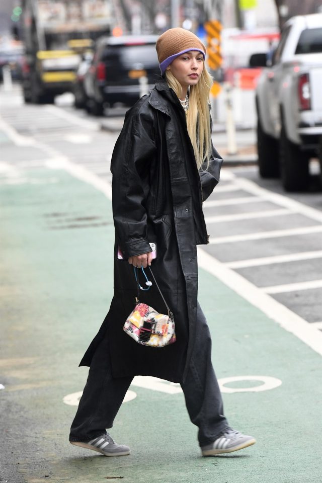 Gigi in full length leather jacket