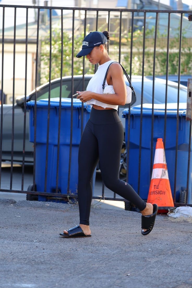 Legging and whit ecropped boyfriend tank top Lori Harvey's street fashion