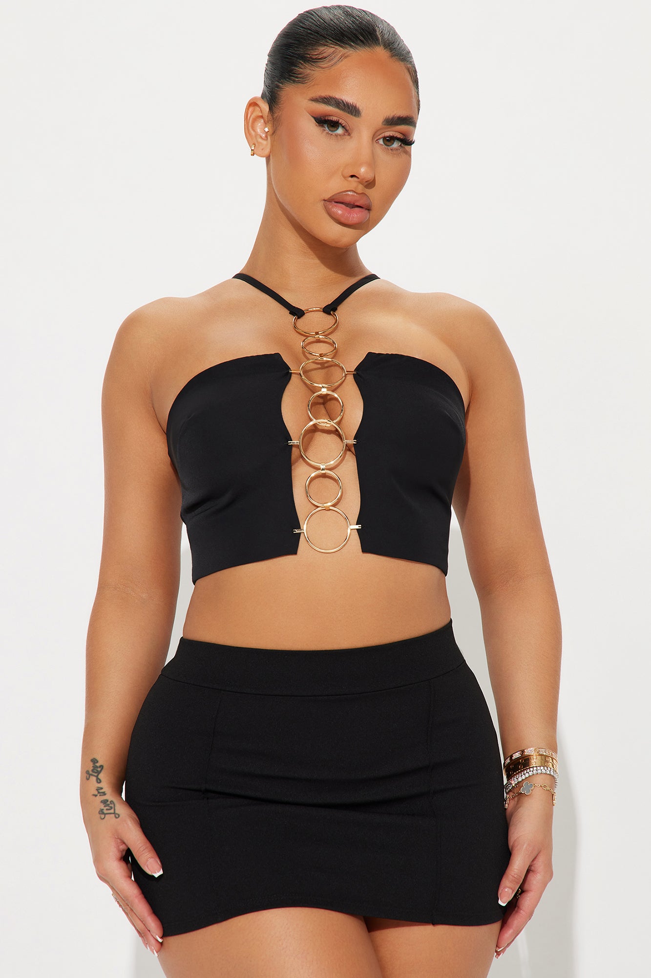 crop top with ring connector with mini skirt statement pieces