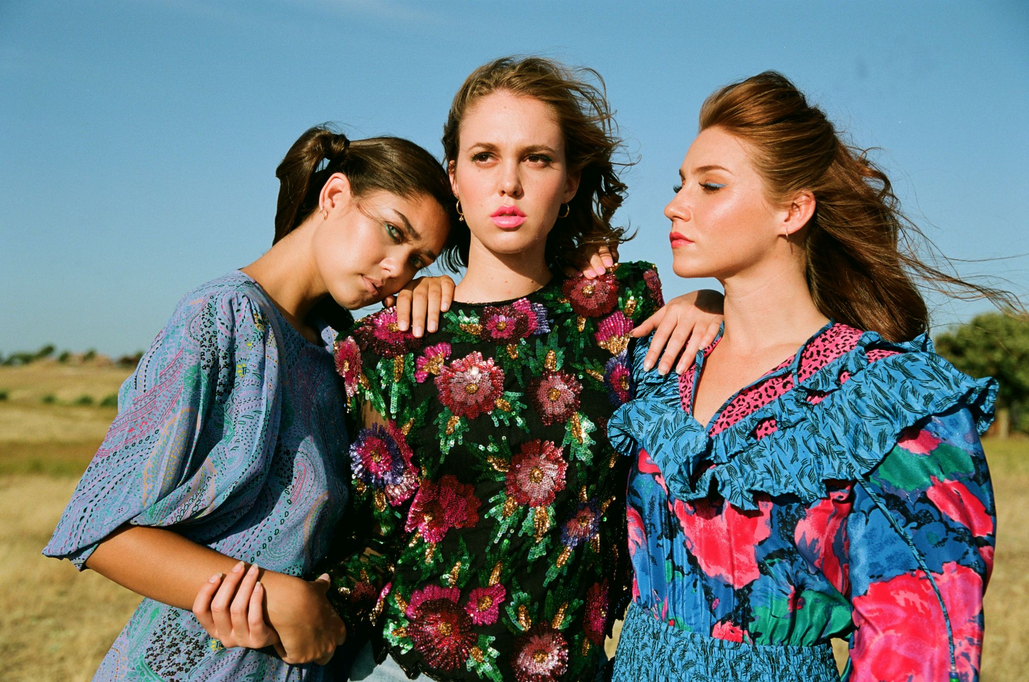 3 girls wearing 1980's fashion 