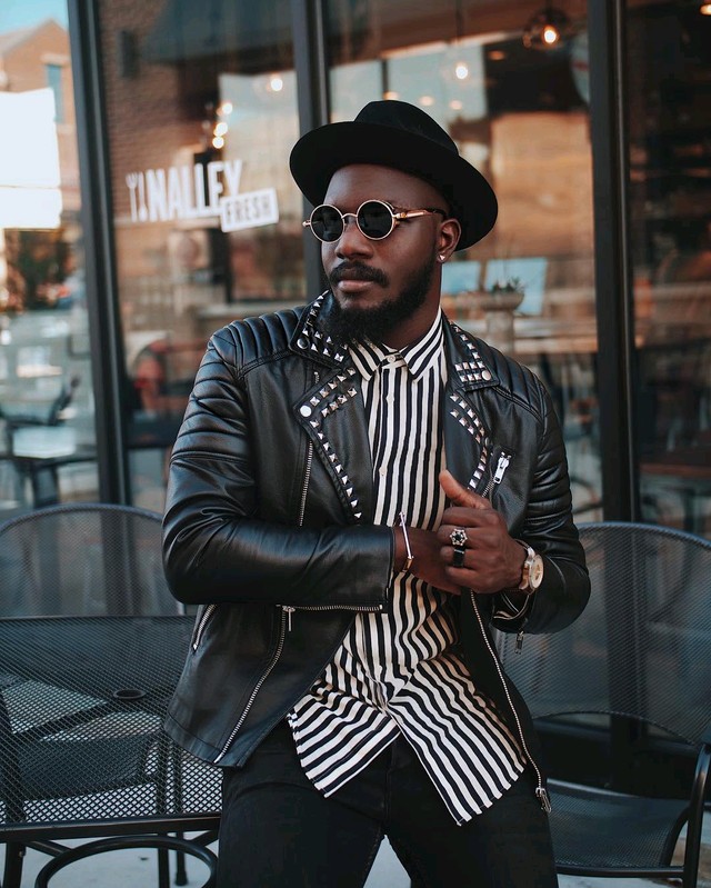 Man in Leather jacket with round sun glasses men's style tips