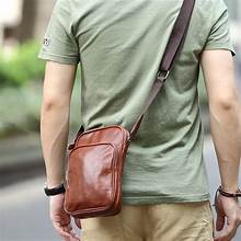 Man carrying should bag handbags for men   