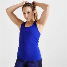 exercise center sando woman in exercise gear tying up hair 