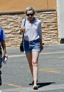 Julia Garner in a denim short