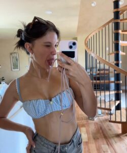 Millie bobby brown looks stunning in a pale blue gingham bikini top