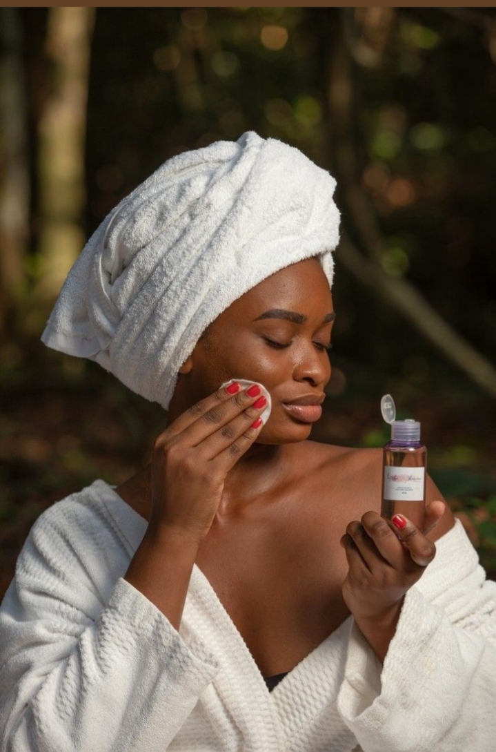 radiant skin with skincare woamn in towel applying creme