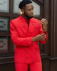 Chimezie Imo in a red suit