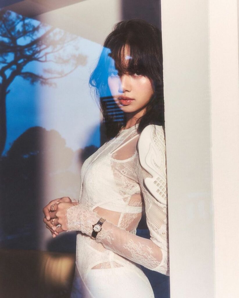 Blackpink's Lisa in Dion Lee looking through window 