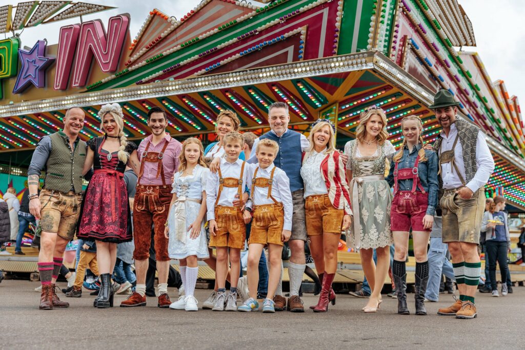 Lederhosen large group of people in tradional bavarian clothes.