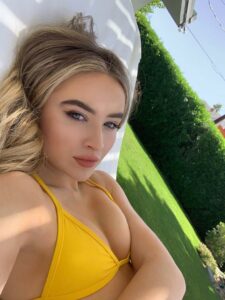 sabrina carpenter in a yellow bikini