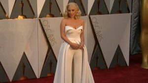 Marlee Matlin at Oscars Award with a creem jumpsuit