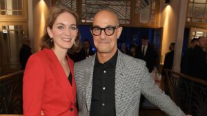 Felicity blunt in a red suit