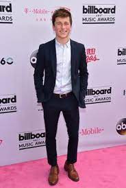 Skyler Gisondo film show with a dark blue suit