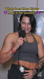 Rhea Ripley high-waist top displaying her tattoos