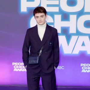 Noah Schnapp white pullneck wear