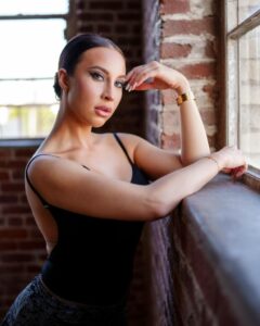 Melissa Stratton with black open back top