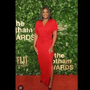 Janelle James glamorous high slit dress