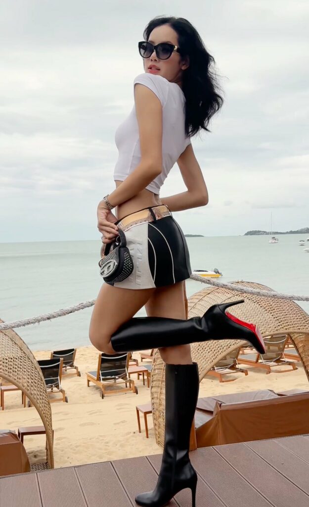 Lisa of Blackpink in short skirt, high boots