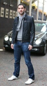 Tom Ellis in a velvet blazer