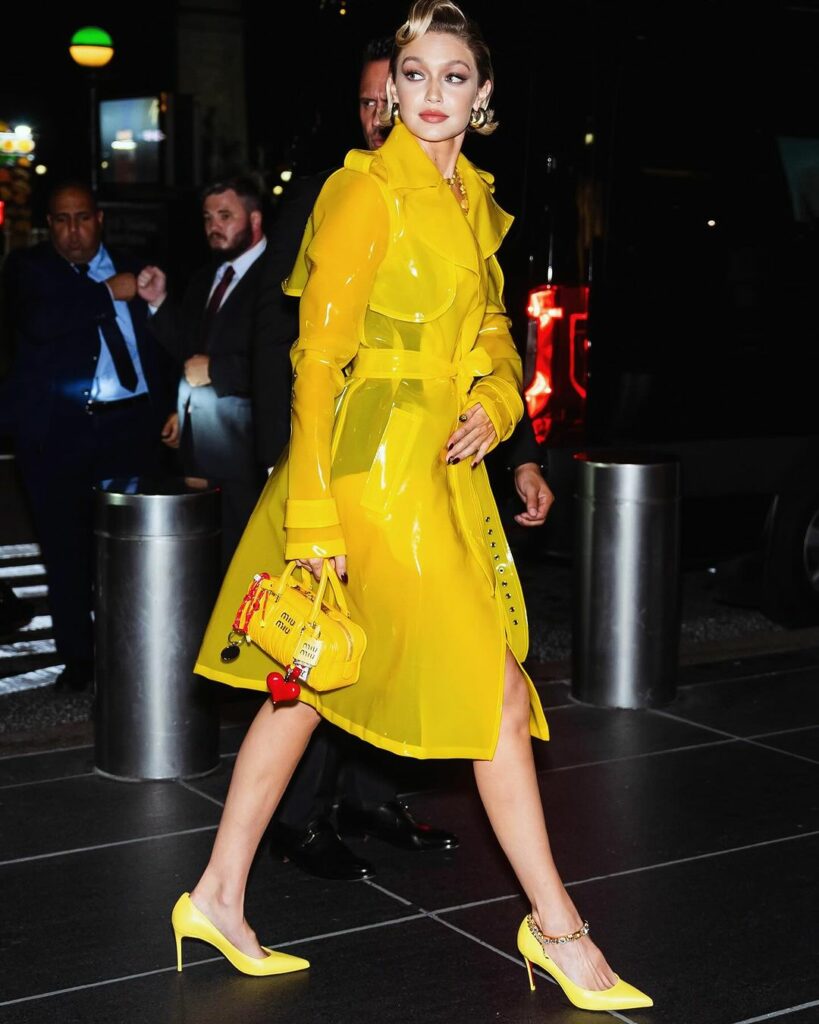 Gigi Hadid in LaQuan Smith yellow raincoat