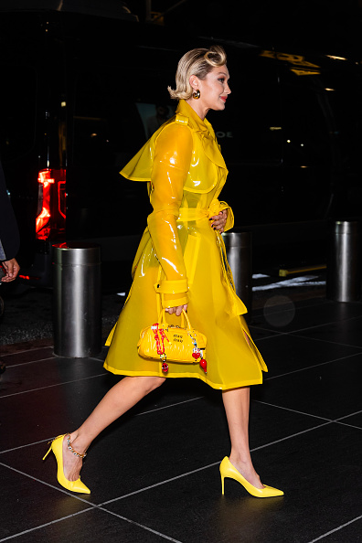 Gigi Hadid in LaQuan Smith walking in raincoat
