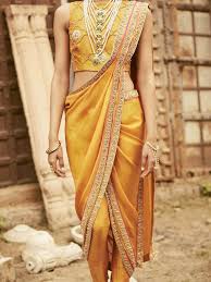 golden saree paired with golden jewelry