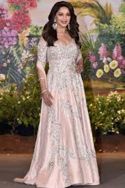 Madhuri Dixit with her crem long-sleeve dress