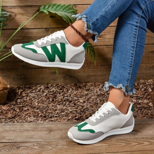 Fashionable sneakers casual with green trim