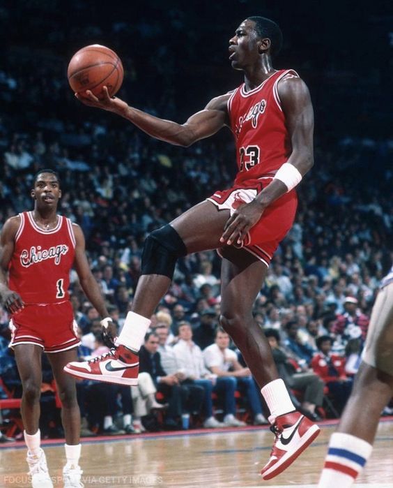 Michael Jordan sportswear holding a basketball