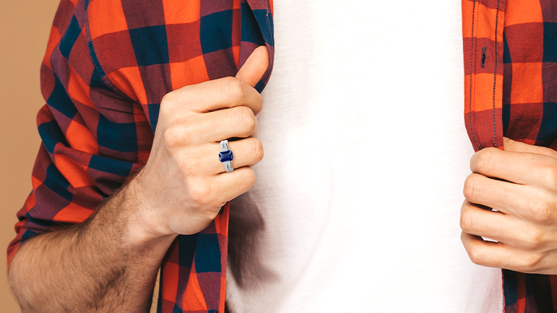 astrological gems man wearing blue ring