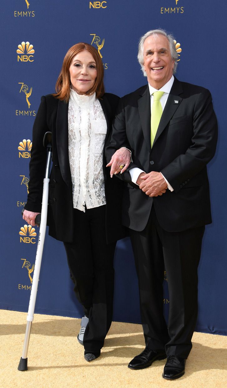 Henry Winkler black suit yellow tie