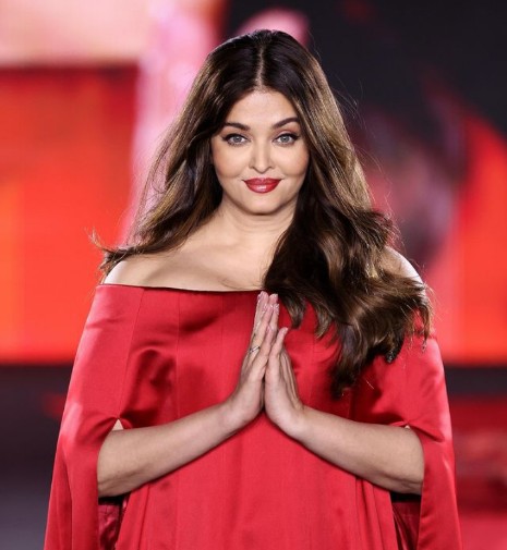 Aishwarya Rai in red cape at Paris Fashion Week