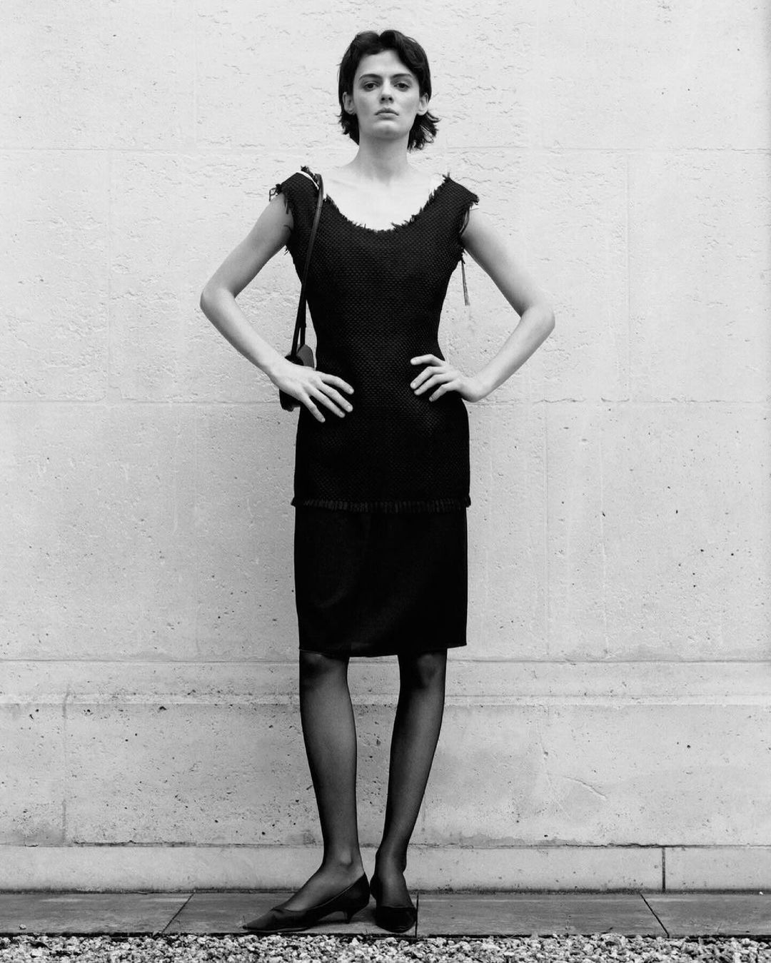 Kendall Jenner Paris Fashion Week Spring 2025 black sleeveless midi dress