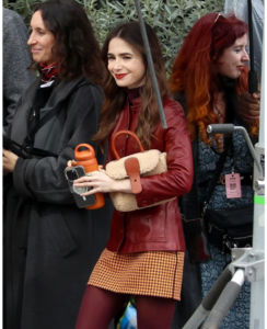 Lily Collins ‘Emily in Paris Netflix Series Season 4’ in a Checkered Miniskirts and Loafers.