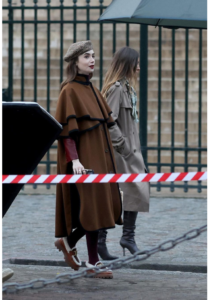 Lily Collins Wearing a Cape Coat and Beret Hat While Filming the ‘Emily in Paris Season 4.