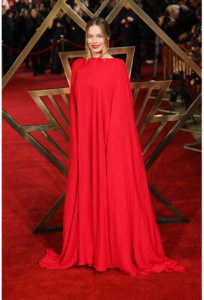 Margot Robbie hot photo wearing a bold red Valentino cape dress at the UK Premiere of Babylon, 2023