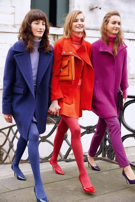 3 women wearing blod colors